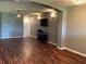 Cozy living room showcasing hardwood floors, a ceiling fan, and a television at 2826 Osprey Cove Pl # 103, Kissimmee, FL 34746
