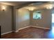 Open-concept living room featuring hardwood floors and recessed lighting at 2826 Osprey Cove Pl # 103, Kissimmee, FL 34746
