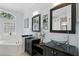 Bright bathroom featuring dual vanities, soaking tub, and natural light at 3618 Rothbury Dr, Belle Isle, FL 32812
