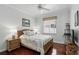 Comfortable bedroom featuring a ceiling fan, wood floors, and a sunlit window with blind at 3618 Rothbury Dr, Belle Isle, FL 32812