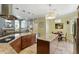 Well-equipped kitchen featuring granite countertops, stainless steel appliances, island and breakfast nook with pool view at 3618 Rothbury Dr, Belle Isle, FL 32812