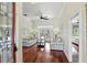 Spacious living room with hardwood floors and French doors to backyard at 3618 Rothbury Dr, Belle Isle, FL 32812