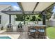 Outdoor kitchen with stone accents, stainless steel grill and seating at 3618 Rothbury Dr, Belle Isle, FL 32812
