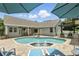 Inviting backyard pool with water fountain and outdoor kitchen at 3618 Rothbury Dr, Belle Isle, FL 32812