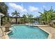 Stunning backyard featuring a refreshing pool, outdoor kitchen, and lush greenery for relaxation at 3618 Rothbury Dr, Belle Isle, FL 32812