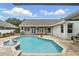 Beautiful backyard pool with fountain and brick paver deck at 3618 Rothbury Dr, Belle Isle, FL 32812