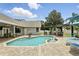 Gorgeous outdoor space with pool, water feature, and patio kitchen at 3618 Rothbury Dr, Belle Isle, FL 32812
