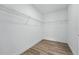 Walk in closet with basic wire shelving and modern flooring at 436 Caraway Dr, Kissimmee, FL 34759