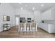 Modern kitchen with stainless steel appliances and a large island with seating at 436 Caraway Dr, Kissimmee, FL 34759