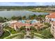 Aerial view of resort with multiple pools, lakes, and surrounding community at 5012 Shoreway Loop # 10107, Orlando, FL 32819