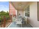 Cozy outdoor balcony with a ceiling fan, stylish rug, and outdoor dining set at 5012 Shoreway Loop # 10107, Orlando, FL 32819