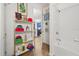 Clean and well-organized bathroom with colorful towels and accessories next to open doorway to kitchen at 5012 Shoreway Loop # 10107, Orlando, FL 32819