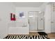 Bright bathroom featuring a tub, glass shower, and a zebra-striped rug at 5012 Shoreway Loop # 10107, Orlando, FL 32819