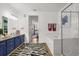 Elegant bathroom with dual sinks, a soaking tub, and a walk-in shower at 5012 Shoreway Loop # 10107, Orlando, FL 32819