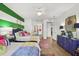 Bright bedroom with twin beds, green stripes, and access to the bathroom at 5012 Shoreway Loop # 10107, Orlando, FL 32819