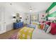 Sunlit bedroom featuring twin beds, decor, and a large window view at 5012 Shoreway Loop # 10107, Orlando, FL 32819