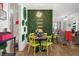 Charming dining area featuring a statement wall, unique decor, and seating for four at 5012 Shoreway Loop # 10107, Orlando, FL 32819