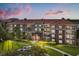 Well-maintained building showcasing a charming facade and lush landscaping at 5012 Shoreway Loop # 10107, Orlando, FL 32819