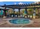 Relaxing hot tub area featuring comfortable lounge chairs and a pergola, perfect for unwinding in a serene community at 5012 Shoreway Loop # 10107, Orlando, FL 32819