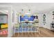 Bright kitchen featuring blue cabinets, stainless steel appliances, and counter seating at 5012 Shoreway Loop # 10107, Orlando, FL 32819