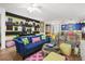 Vibrant living room with colorful decor, striped accent wall, and stylish furniture at 5012 Shoreway Loop # 10107, Orlando, FL 32819