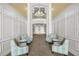 Elegant lobby with high ceilings, stylish seating, and ample natural light creating a welcoming atmosphere for residents at 5012 Shoreway Loop # 10107, Orlando, FL 32819