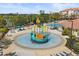 Outdoor water play area with colorful boat slide surrounded by lounge chairs and greenery in a Gathering-friendly community at 5012 Shoreway Loop # 10107, Orlando, FL 32819