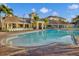 Expansive community pool surrounded by brick patio and lounge chairs with clear, inviting water for residents to enjoy at 5012 Shoreway Loop # 10107, Orlando, FL 32819