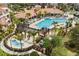 Luxurious community pool with ample lounge seating and a covered pavilion at 5012 Shoreway Loop # 10107, Orlando, FL 32819