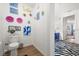Cozy powder room with charming decorations and a unique style at 5012 Shoreway Loop # 10107, Orlando, FL 32819
