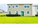 A lush backyard with a sliding glass door and green lawn offers a serene outdoor space at 5107 Longmeadow Park St, Orlando, FL 32811