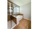 Bathroom featuring a glass enclosed shower and a tub with tile surround at 5107 Longmeadow Park St, Orlando, FL 32811