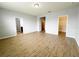 Spacious bedroom featuring wood-look flooring and neutral paint, with ample natural light at 5107 Longmeadow Park St, Orlando, FL 32811
