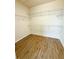 Walk-in closet with shelving, offering optimal storage at 5107 Longmeadow Park St, Orlando, FL 32811