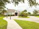 Charming clubhouse with well-maintained landscaping, inviting sidewalk, and community gathering space at 5107 Longmeadow Park St, Orlando, FL 32811