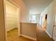 Well-lit hallway with pantry access at 5107 Longmeadow Park St, Orlando, FL 32811