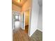 Hallway with closet and views to bedroom with wood-look flooring at 5107 Longmeadow Park St, Orlando, FL 32811