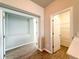 Hallway view into additional rooms; features wood-look floors and neutral-toned walls at 5107 Longmeadow Park St, Orlando, FL 32811