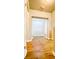 Hallway view looking into a bedroom or office area; features wood-look floors at 5107 Longmeadow Park St, Orlando, FL 32811
