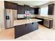 Modern kitchen with stainless steel appliances, granite countertops and island at 5107 Longmeadow Park St, Orlando, FL 32811