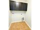 Laundry room with overhead cabinets at 5107 Longmeadow Park St, Orlando, FL 32811