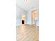 Open living room featuring wood-look flooring and neutral gray walls at 5107 Longmeadow Park St, Orlando, FL 32811