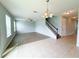 Open concept living room featuring hard surface flooring, tile, a ceiling fan, and natural light at 5107 Longmeadow Park St, Orlando, FL 32811