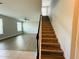 Inviting living room features wood floors, ceiling fan, and staircase access at 5107 Longmeadow Park St, Orlando, FL 32811
