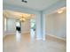 Inviting living room with tile floors, chandelier, and an open floor plan at 5107 Longmeadow Park St, Orlando, FL 32811