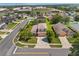 Aerial view of a landscaped property on a quiet street at 5200 Sunset Canyon Dr, Kissimmee, FL 34758