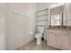 Bathroom features a toilet and vanity with great natural light at 5200 Sunset Canyon Dr, Kissimmee, FL 34758