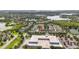 Aerial view of a residential community with lakes, trees, and homes at 5235 Keenes Pheasant Dr, Windermere, FL 34786