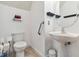 Small bathroom with toilet and modern-style sink and mirror at 5235 Keenes Pheasant Dr, Windermere, FL 34786