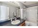 Bathroom with vanity and shower with white tiles, and a shower curtain at 5235 Keenes Pheasant Dr, Windermere, FL 34786